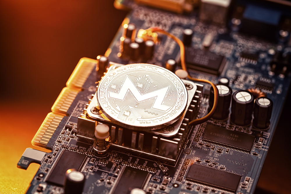 Monero Cryptocurrency coin on a PC computer graphic card, crypto currency mining concept