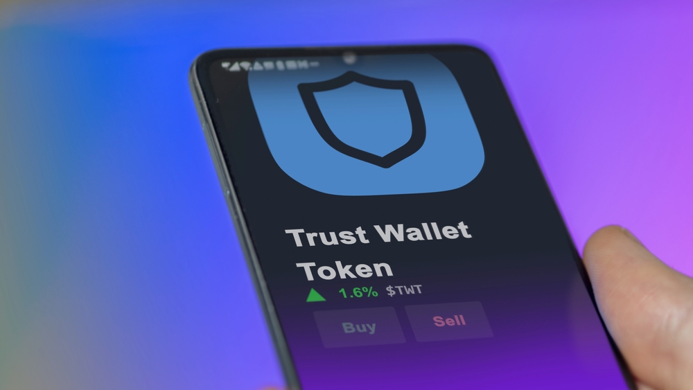 An investor analyzing the price of Trust Wallet Token, the token coin $TWT on a crypto exchange sreen.