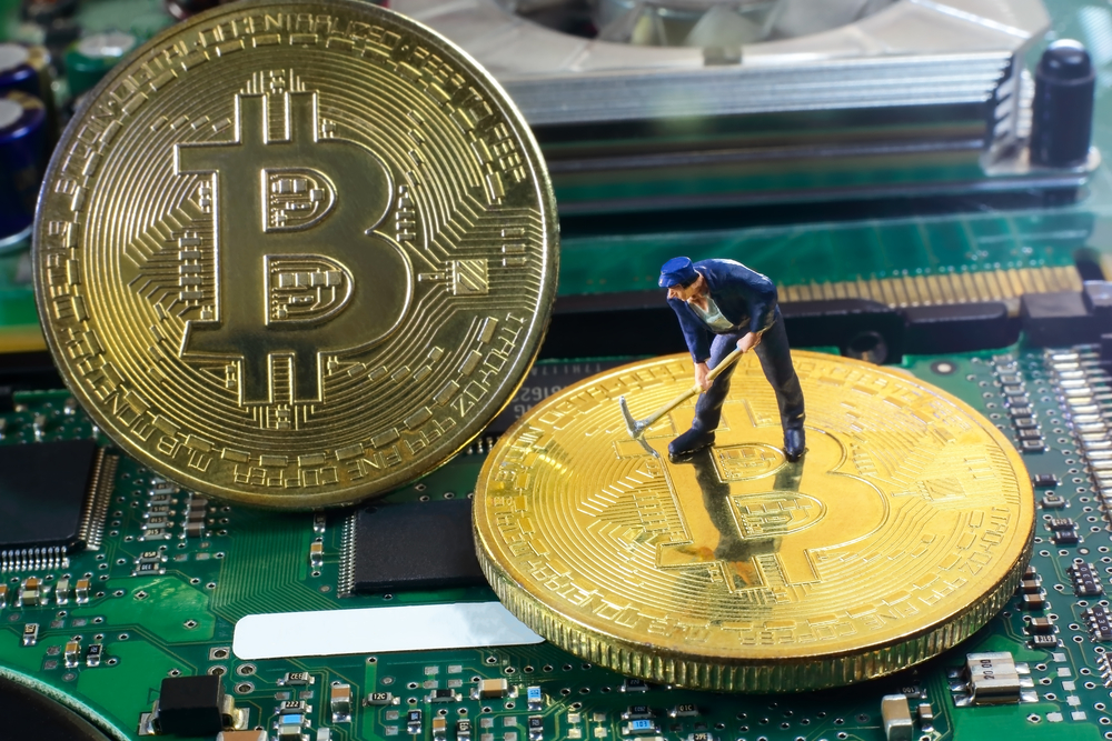 A little miner is digging for bitcoin with graphic card. conceptual image for bitcoin mining and crypto currency.