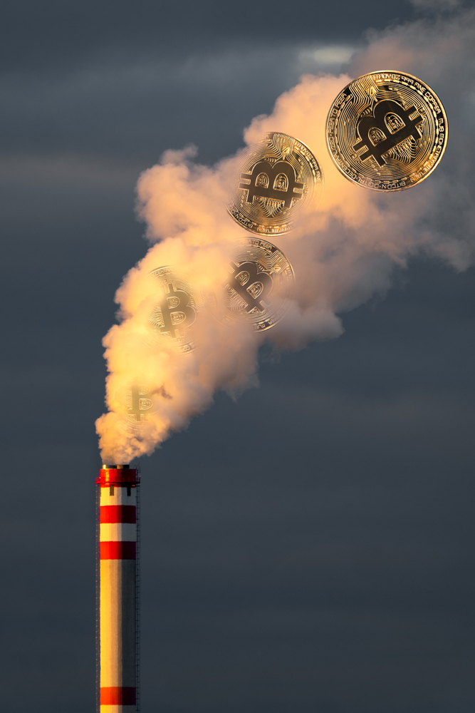 Composite of heavy smoke from factory chimney and golden bitcoins. Crypto currency energy demand.