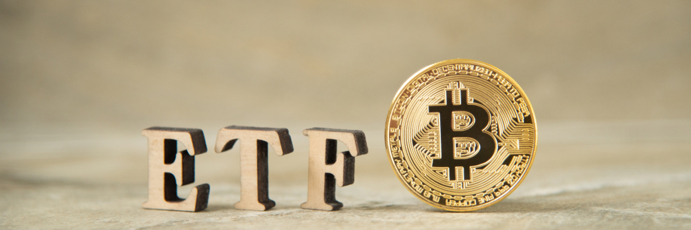 Bitcoin coin with ETF text on stone background, Concept Entering the Digital Money Fund. ETF and Bitcoin cryptocurrency concept