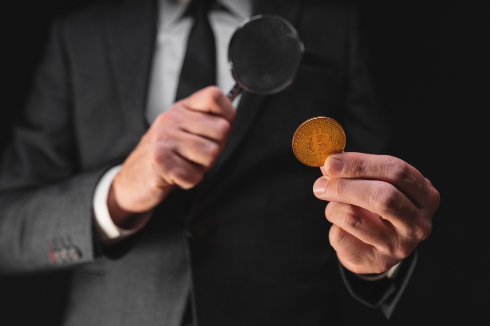 Tax agency officer inspecting Bitcoin cryptocurrency exchange transaction, conceptual image