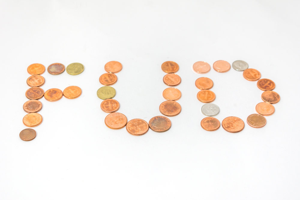 Fear Uncertainty Doubt Abbreviation Spelled with Coins Cryptocurrency Trading Market