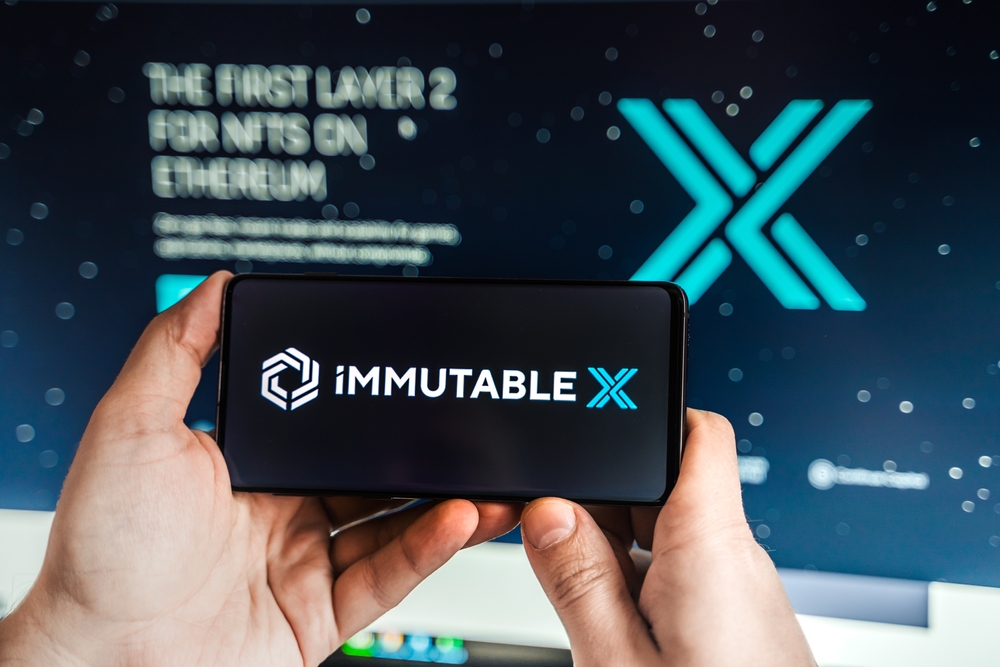Logo,screenshot of Immutable X, IMX token.Blockchain nft ethereum cryptocurrency game in laptop,mobile phone.