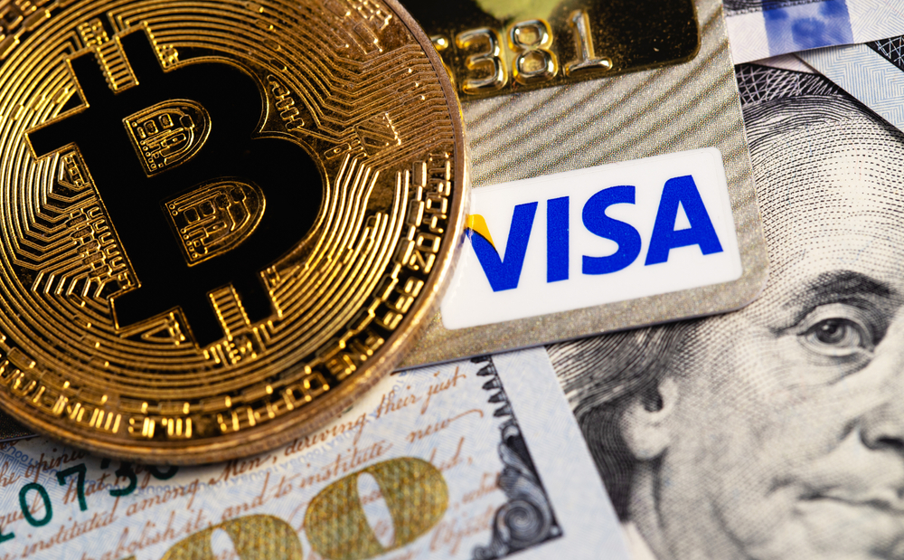 bitcoin cryptocurrency with Visa credit card and dollars, money.