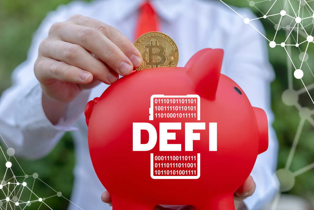 Businesswoman holding red piggy bank with smartphone DEFI icon and put bitcoin.