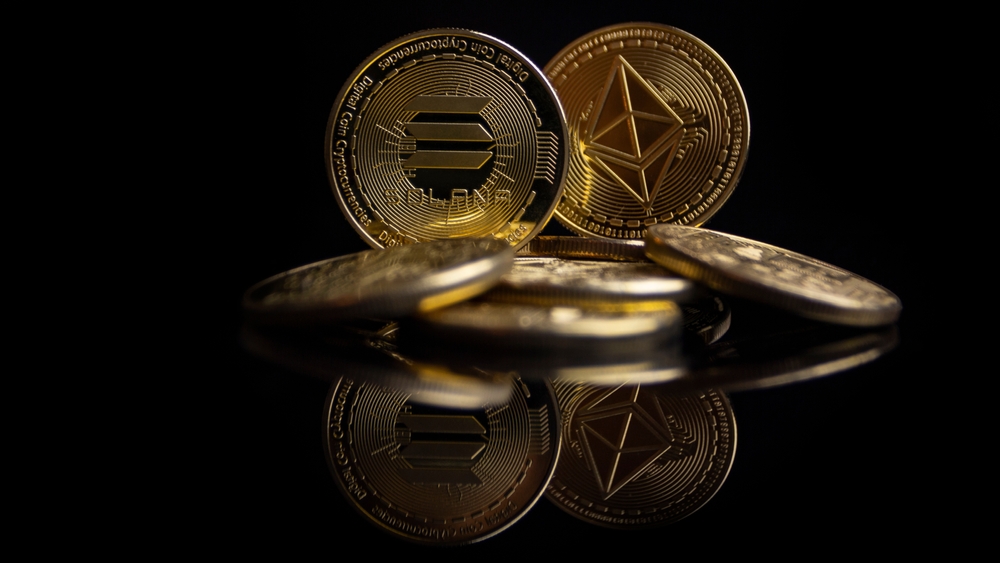 Solana coin with an Ethereum coin behind it that is slightly blurred against a black background