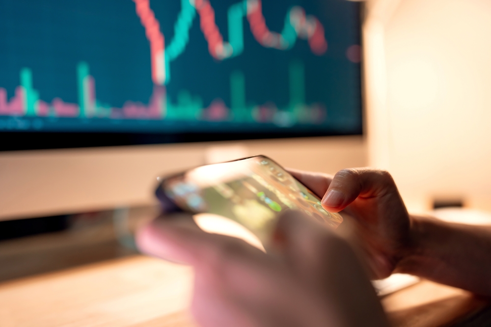 Close-up - Hands of woman playing blockchain nft game in mobile phone