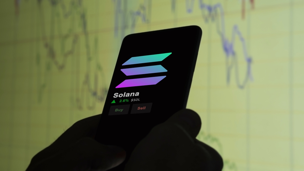 An investor analyzing the price of solana on a phone, the token coin $SOL on a crypto exchange sreen.