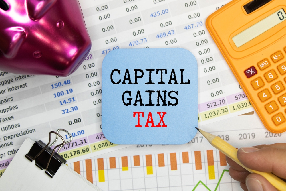 Capital gains tax-text label in the form of a document Registrar planning folder. 