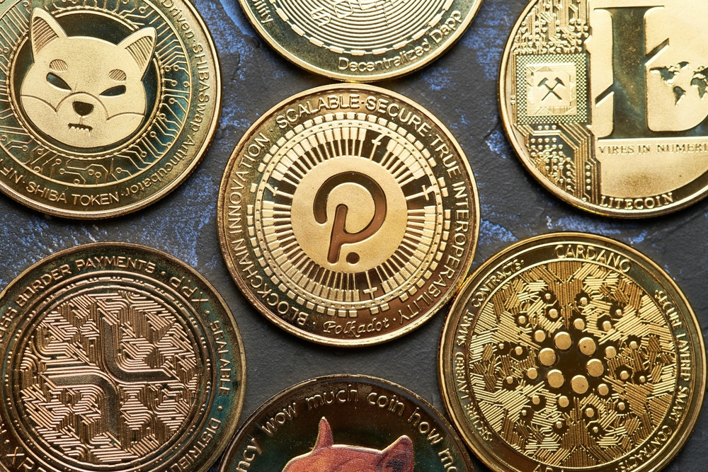 Close up of Polkadot cryptocurrency and Various cryptocurrencies with dark textured background and view from above