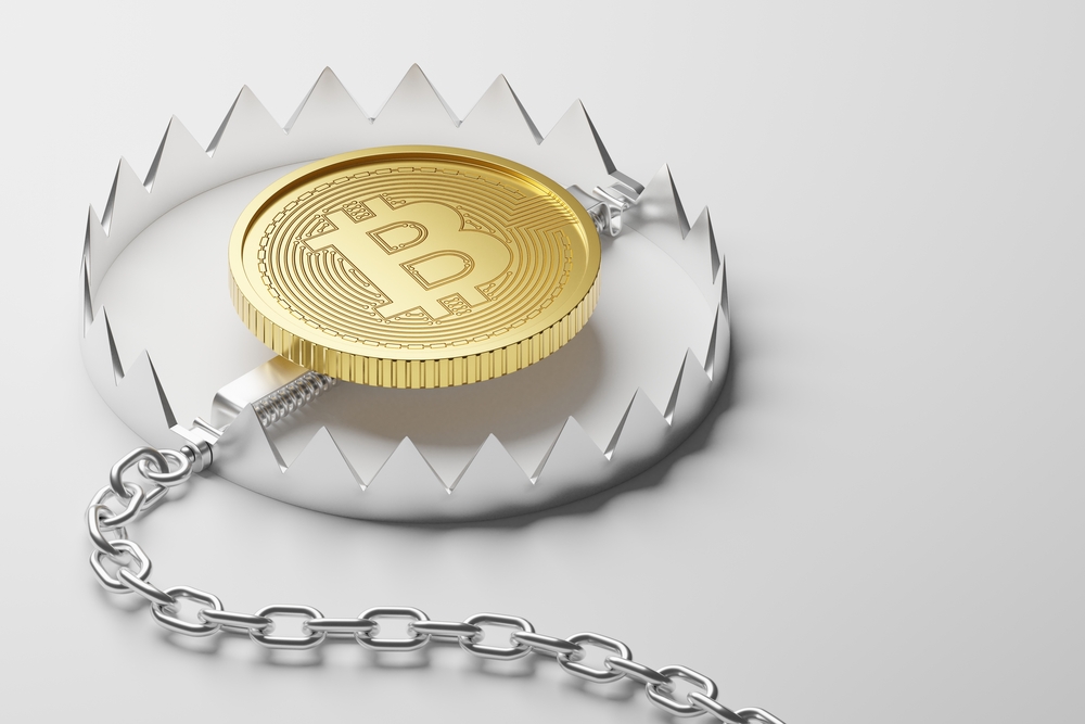 Isometric 3D rendering gold Bitcoin with iron trap