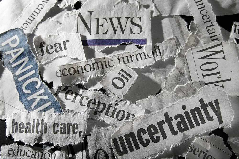 various newspaper headlines showing economic concepts