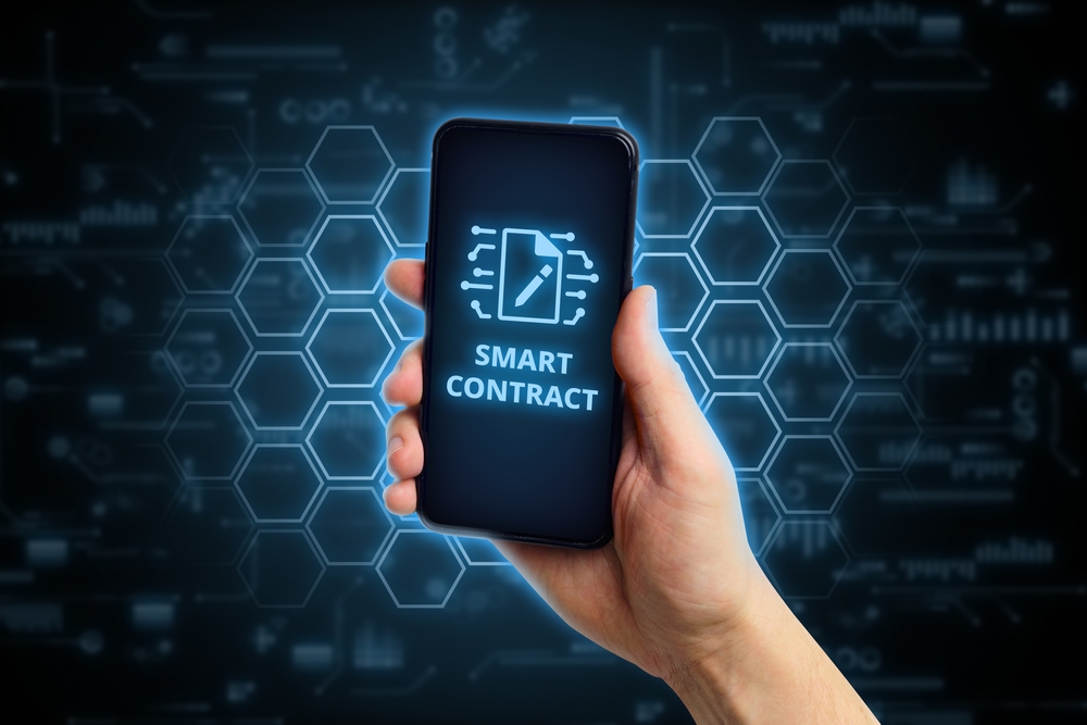 Smart contract concept. Person holding smartphone with icon