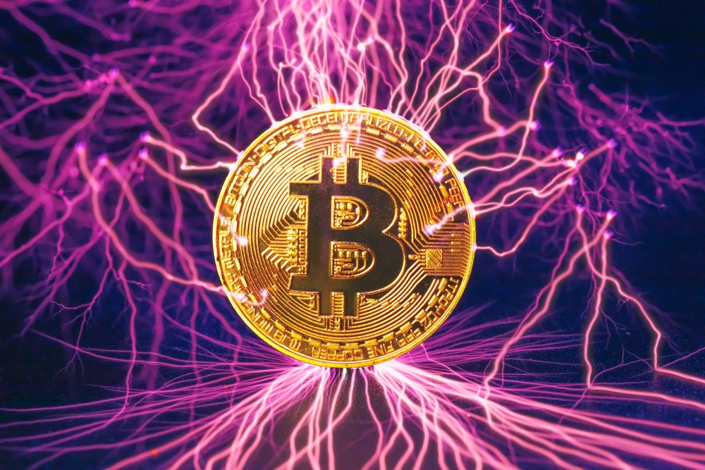 bitcoin gold coin with electric lightning strikes