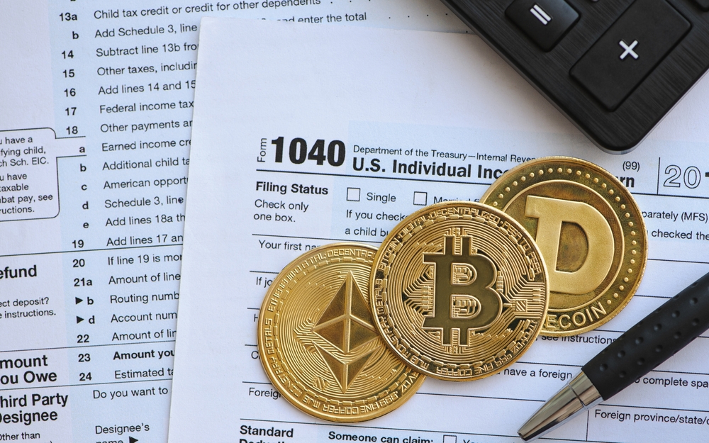 Bitcoin taxation or cryptocurrency concept with US tax form 1040 in Individual Income Tax Return.