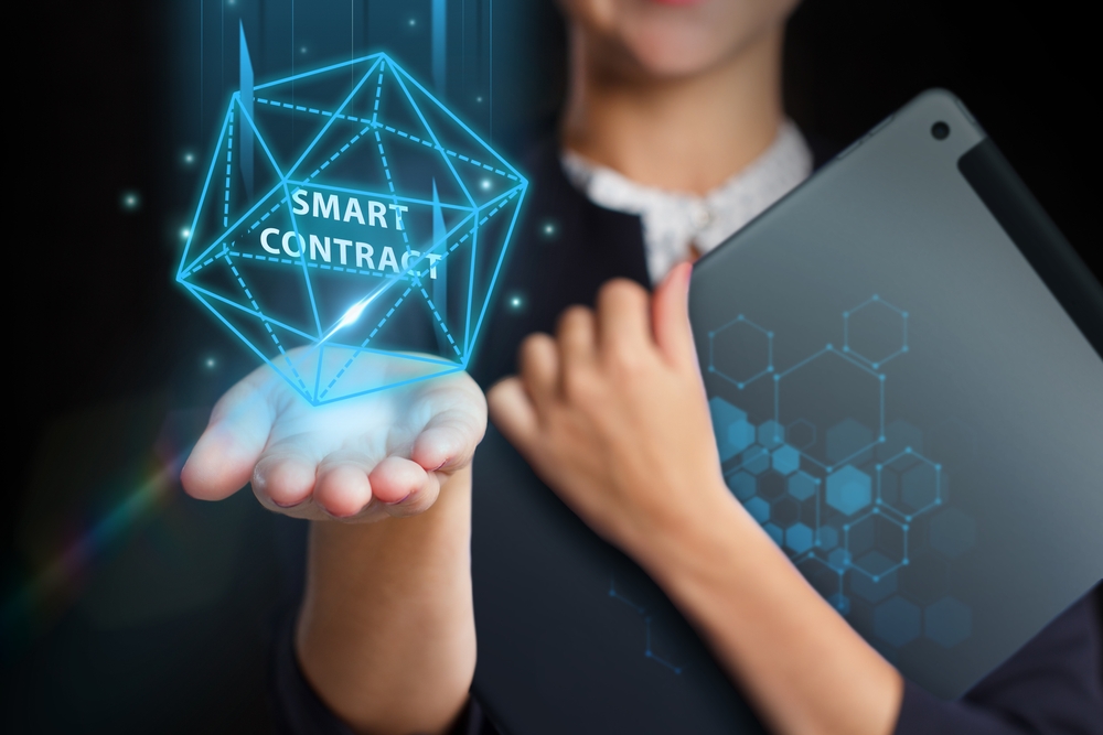 Business, Technology, Internet and network concept. Young businessman working on a virtual screen of the future and sees the inscription: Smart contract