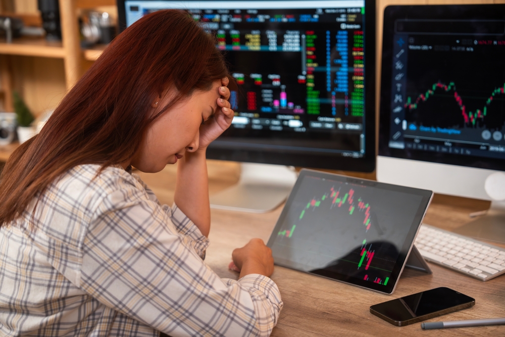 Stressed businesswoman feeling desperate on crisis stock market, investment concept.