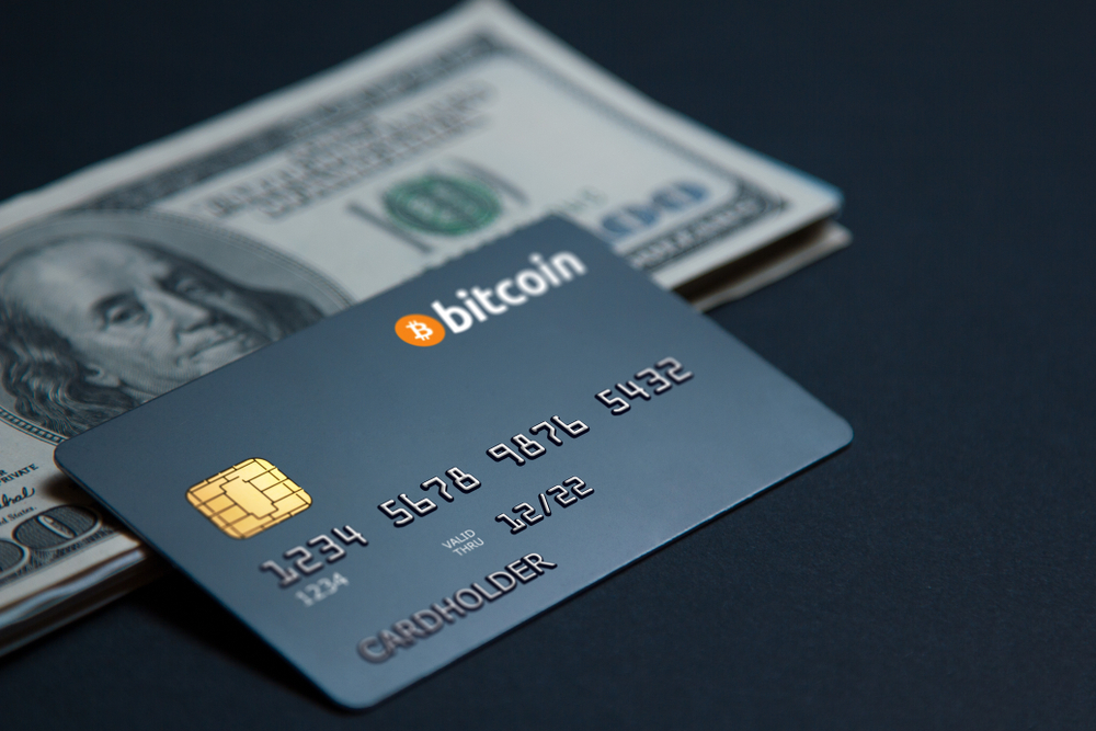 Concept bank card bitcoin on a dark background