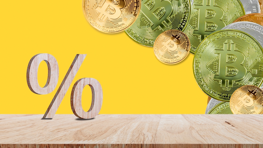 Close-up of percent sign on coin crypto currency bitcoin background, Percentage Sign And Discount Rate. Accountant VAT Tax Concept.