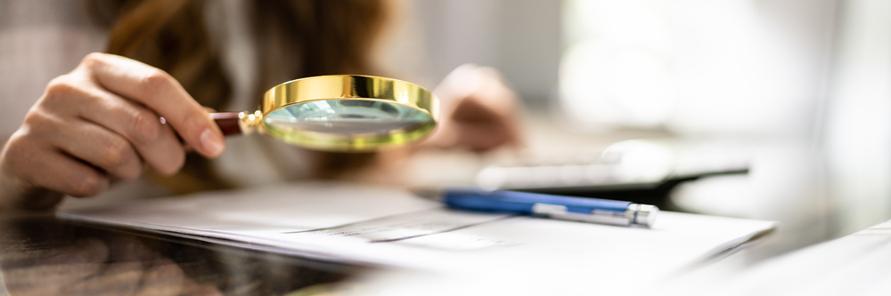 Business Fraud Investigation Using Magnifying Glass. Finance And Tax