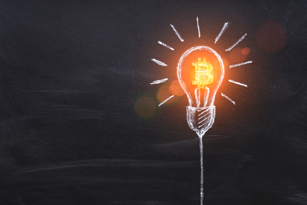 Bitcoin business idea. Cryptocurrency symbol in light bulb. Creativity, thinking