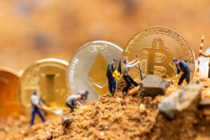 little miner is digging for bitcoin . conceptual image for bitcoin mining and discovery crypto currency. , financial concept