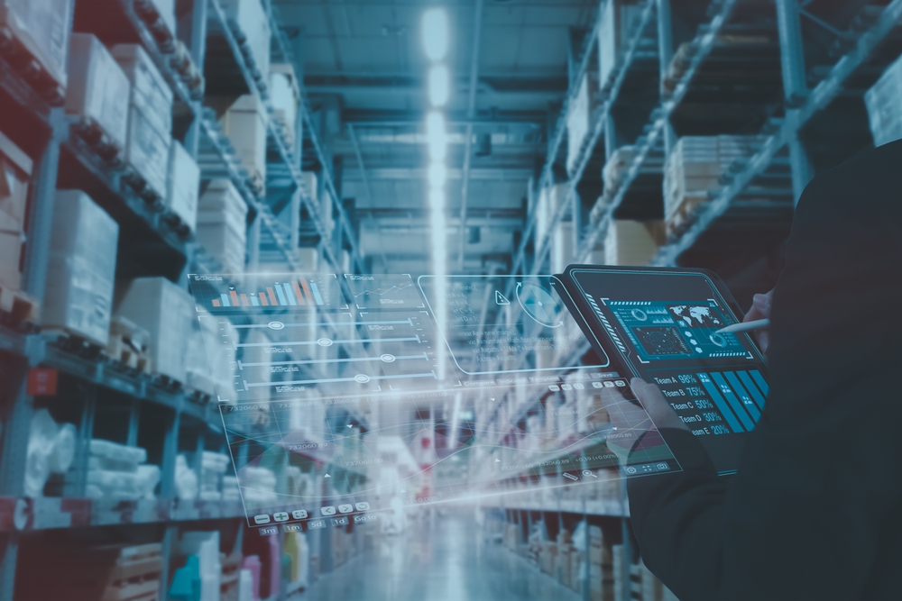 Manager using smart tablet monitor process Analyzes, check and control product in stock warehouse, modern software, futuristic concept smart warehouse management system in Factory industry in