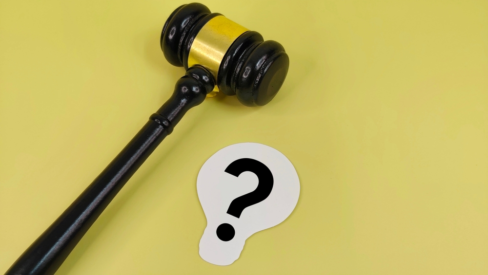 Judge’s Gavel with Question Mark Symbol Representing Legal Uncertainty, Courtroom Doubt, Judicial Dilemma, and Law Interpretation in Justice System.