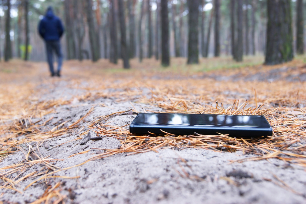 The man lost a phone in the forest.