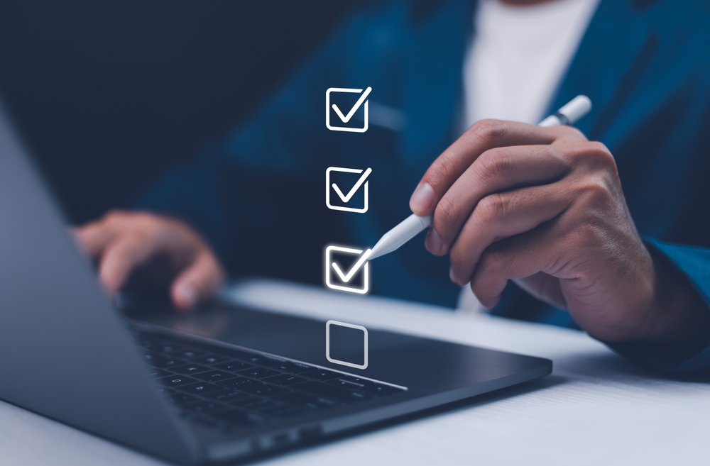 Checklist concept, Businessman mark checkboxes, Survey form, check marks on checklist, filling online form and answering questions.